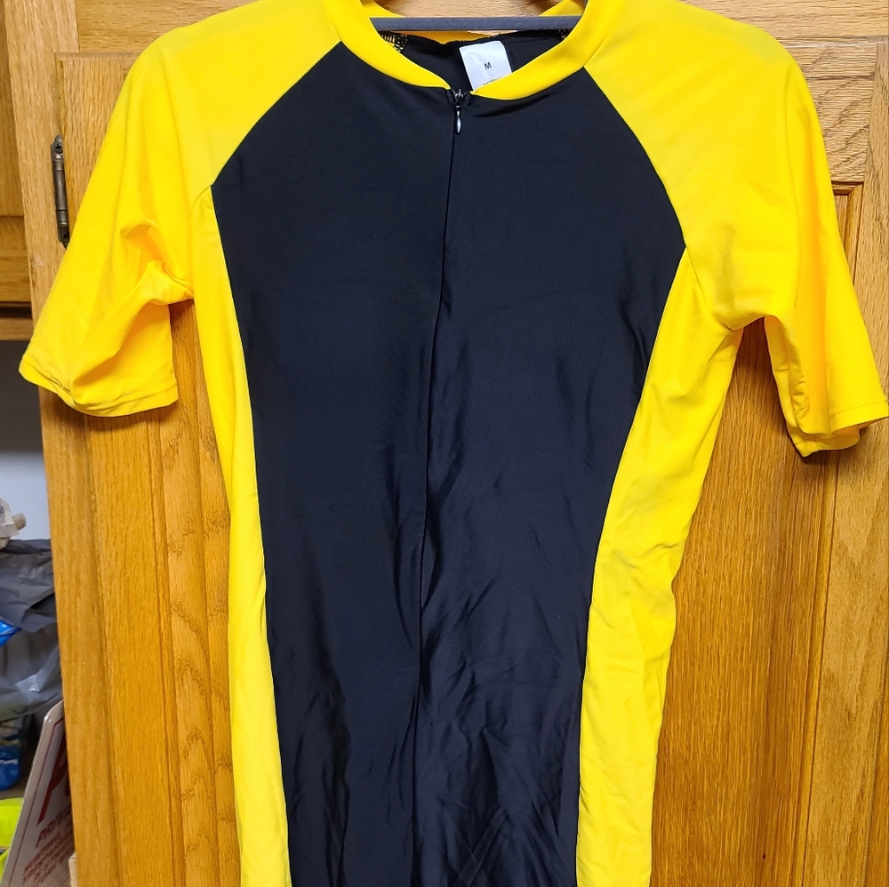 One piece Sports Gear swimsuit with trunks and short sleeves.  Black and Yellow